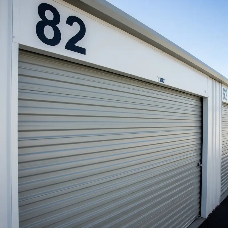 Metal roll-up self-storage unit door number 82